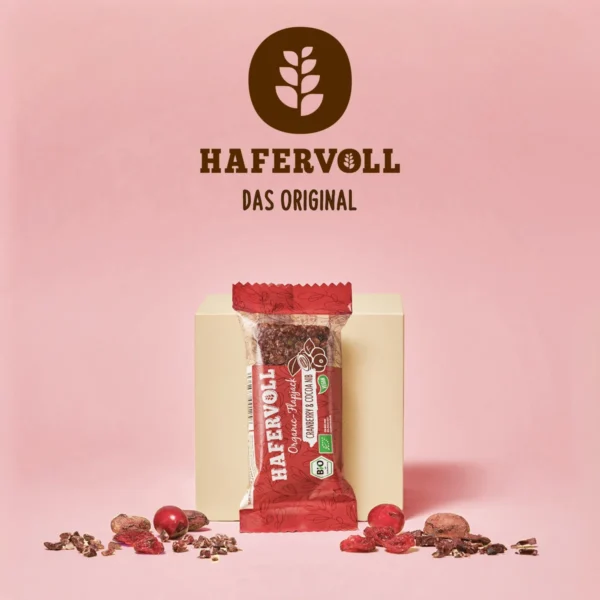 HAFERVOLL Organic Flapjack Cranberry & Cocoa Nib 60g – Verpackung mit HAFERVOLL-Logo und Cranberrys